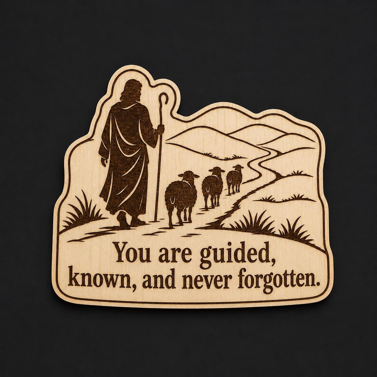 Front close-up of Shepherd Wood Plaque Guided and Known Quote Sign Inspirational Birch Wall Art With Sheep, showing dark engraving on natural birch wood.