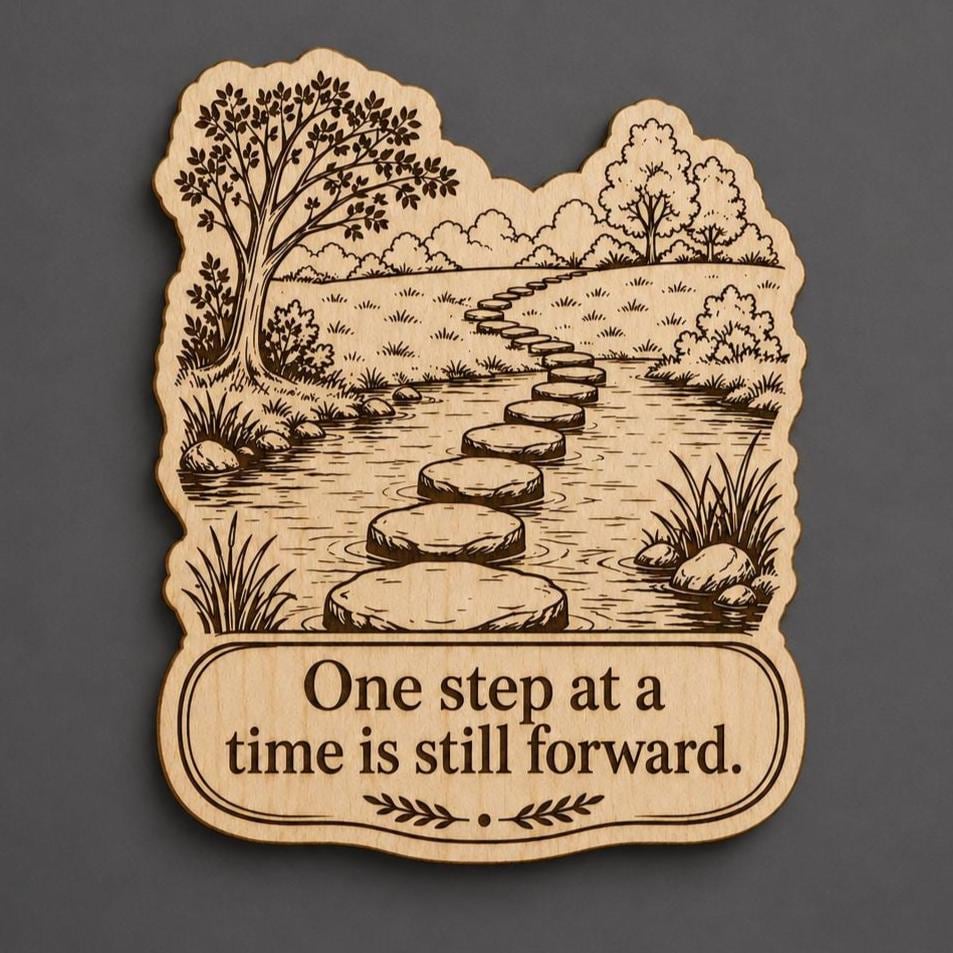 Front close-up of One Step at a Time Wood Plaque Inspirational Stream Stepping Stones Wall Art, showing dark engraving on natural birch wood.