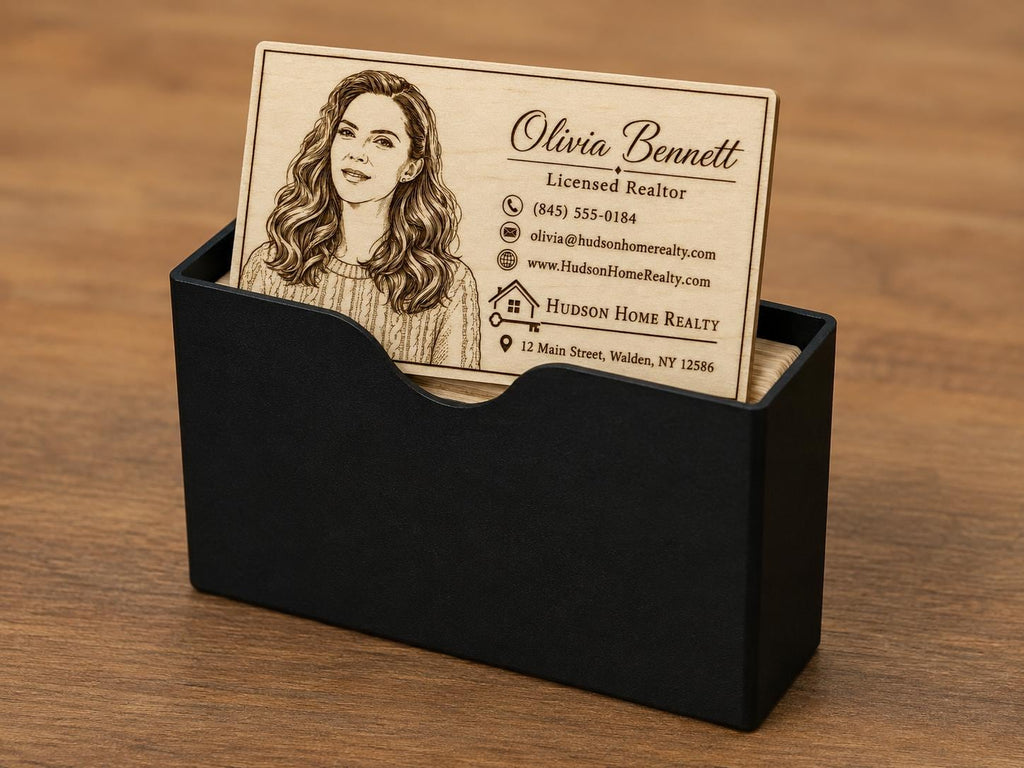 Personalized engraved birch realtor card standing upright in the included black card holder.