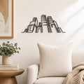 Modern City Skyline wall art in black, shown at 12-inch scale in a modern living room