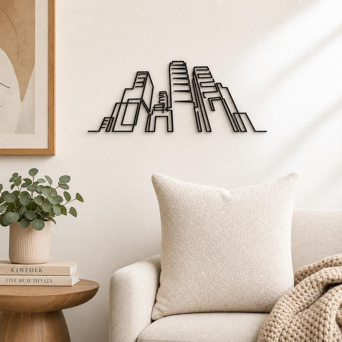 Modern City Skyline wall art in black, shown at 12-inch scale in a modern living room