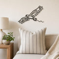 Flying Eagle wall art in black, shown at 12-inch scale in a modern living room