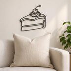Cake Slice wall art in black, shown at 12-inch scale in a modern living room