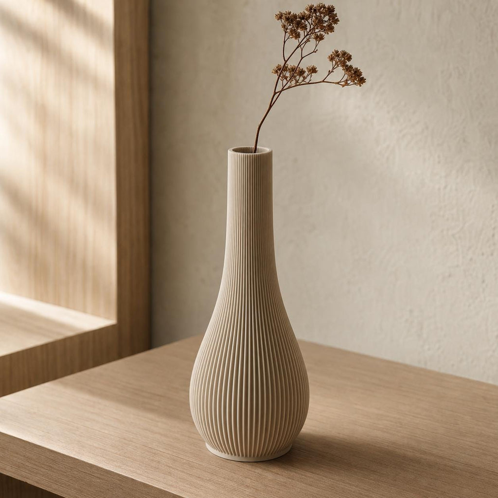 Close-up of the Serein ribbed bud vase in Desert Tan with a delicate dried branch