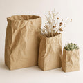 Close-up of three PaperMuse crumpled bag containers in Small, Medium, and Large sizes