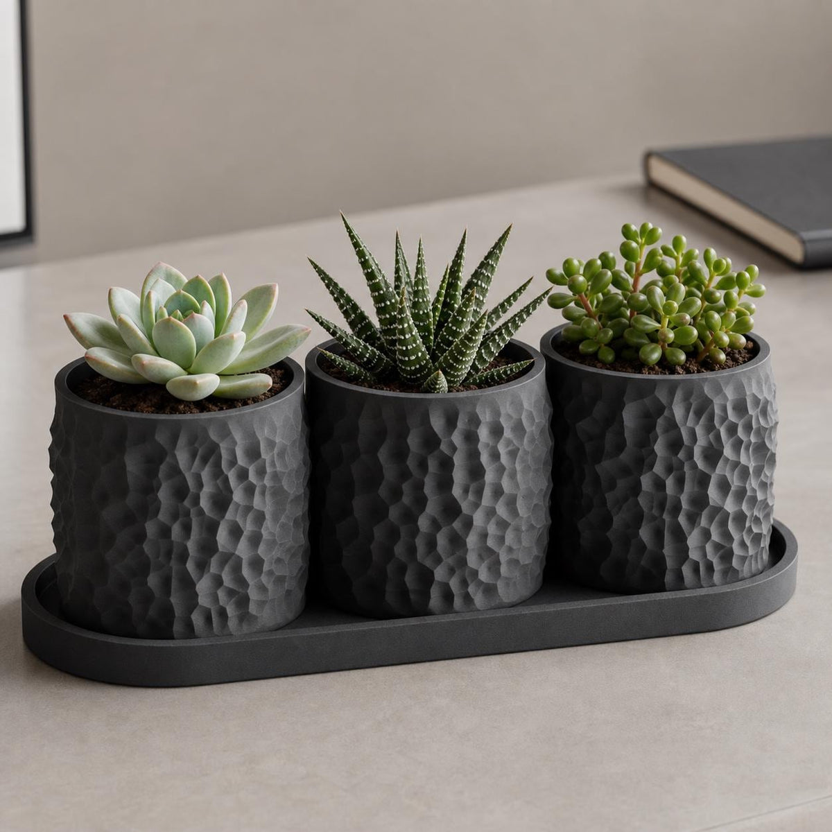 Close-up Charcoal Tessellune mini planter trio styled on a desk