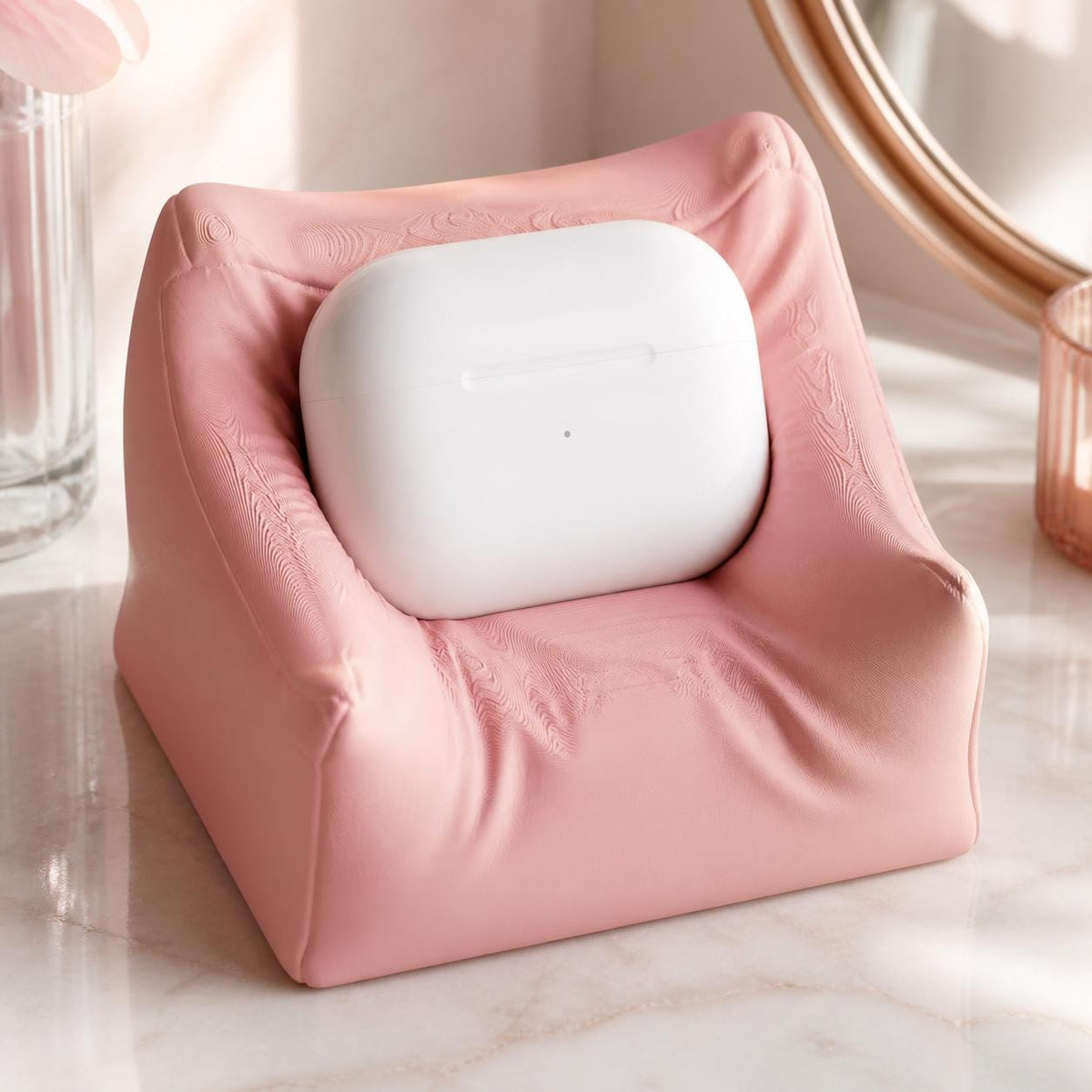 Close-up of the Sakura Pink PillowPod charging case stand on a vanity