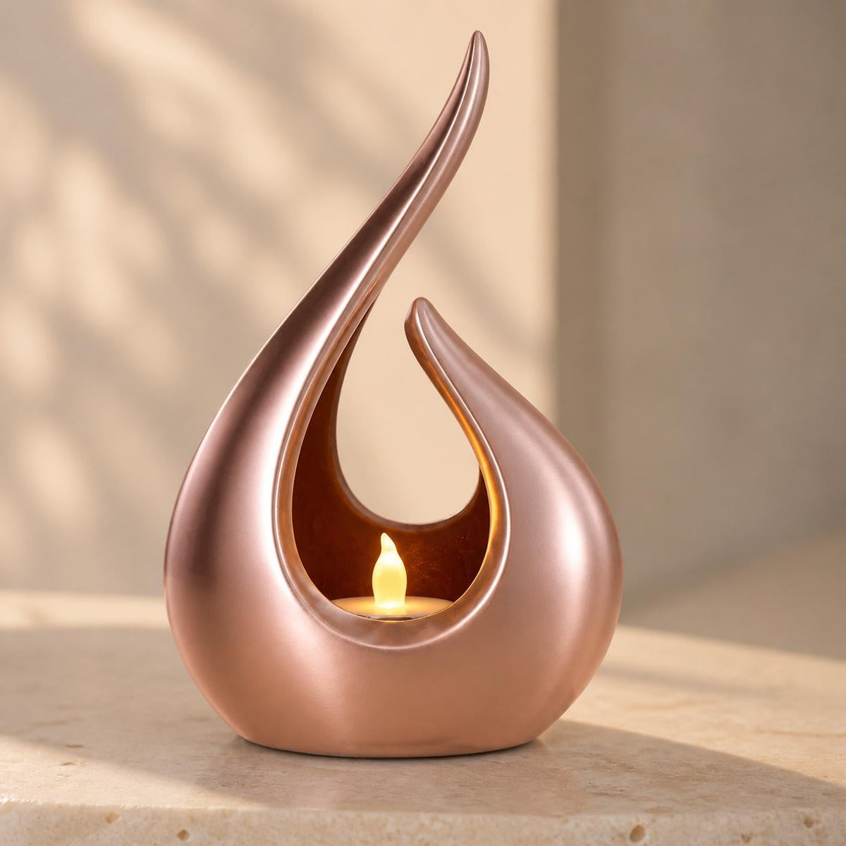 Emberveil sculptural LED tealight holder in lustrous Silk Rose Gold with a warm glow