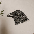 Close-up of Raven Head filigree wall art in black at accurate 12-inch scale