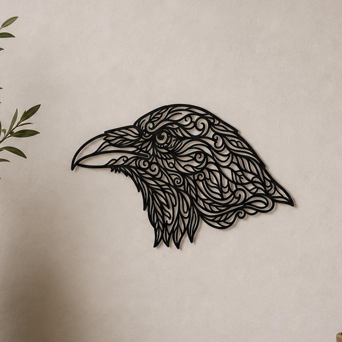 Close-up of Raven Head filigree wall art in black at accurate 12-inch scale