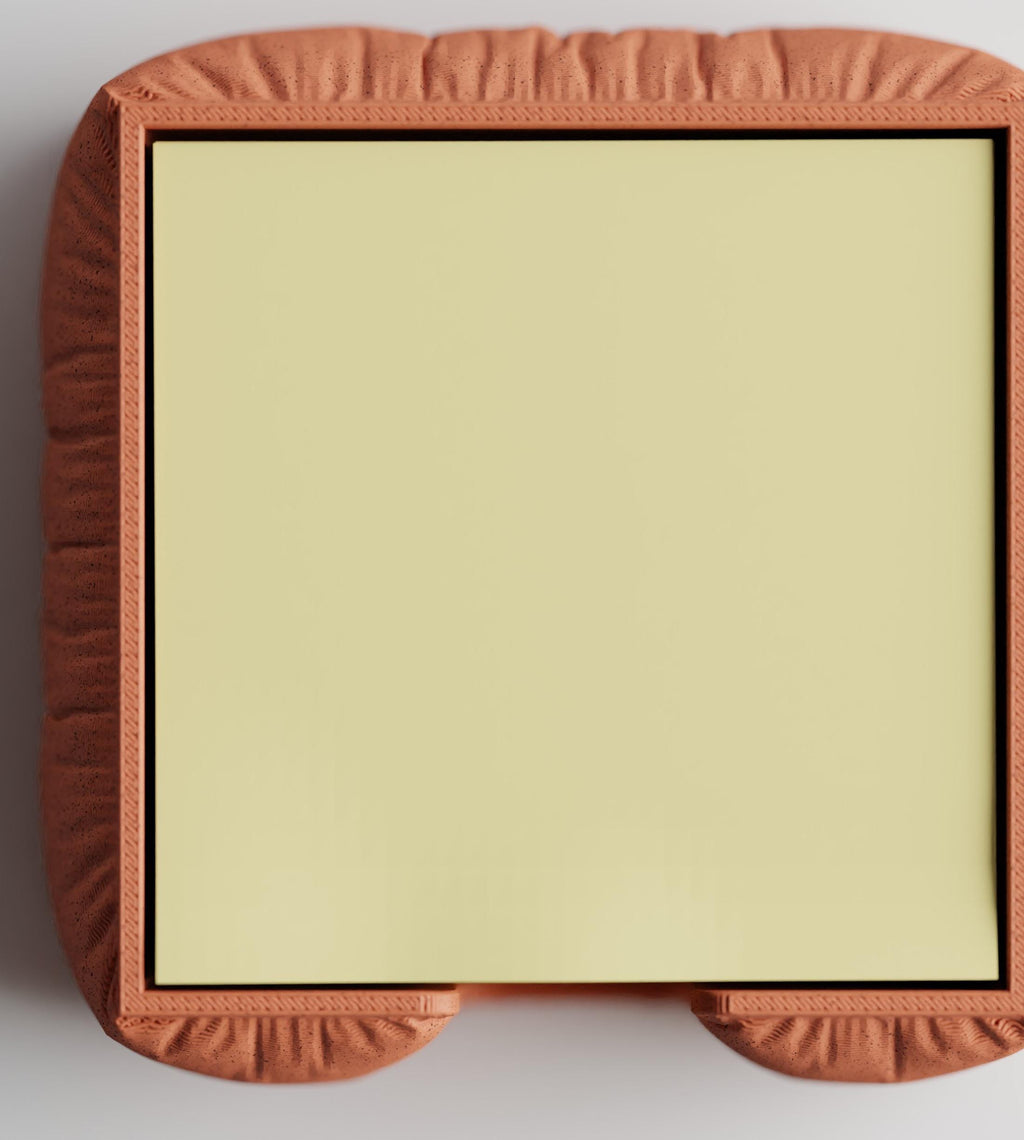Top close-up of the GatherPad holder with a square sticky note pad for scale