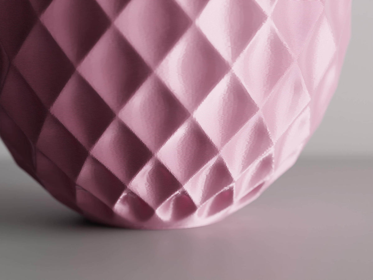 Extreme close-up of the GemLattice vase raised geometric facets and light-catching texture
