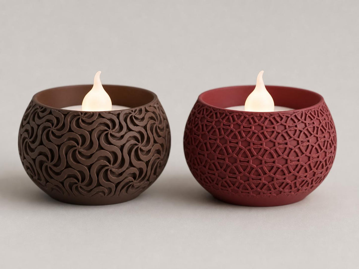 Close-up of Dark Brown Pinwheel and Dark Red Loop Lattice VowGlow LED tealight holders