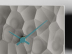 Close-up of the Ash Gray faceted texture and Sky Blue clock hands