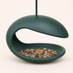 Front view of the Forest Green Mooncurve Haven feeder and covered seed bowl