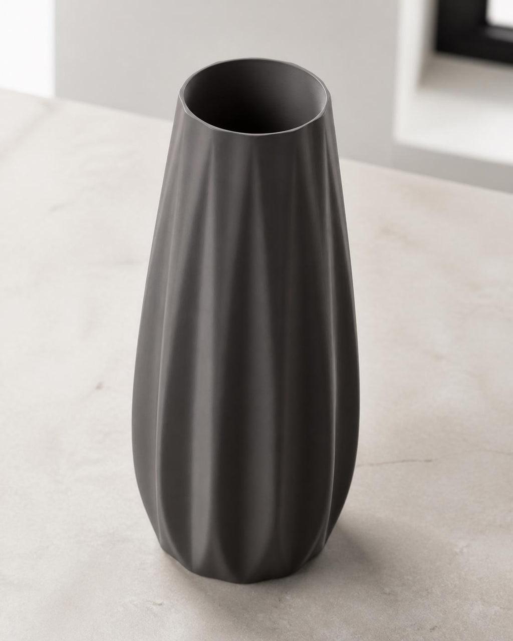 Elevated three-quarter close-up of a Charcoal Loomrise vase showing the open rim