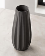 Elevated three-quarter close-up of a Charcoal Loomrise vase showing the open rim