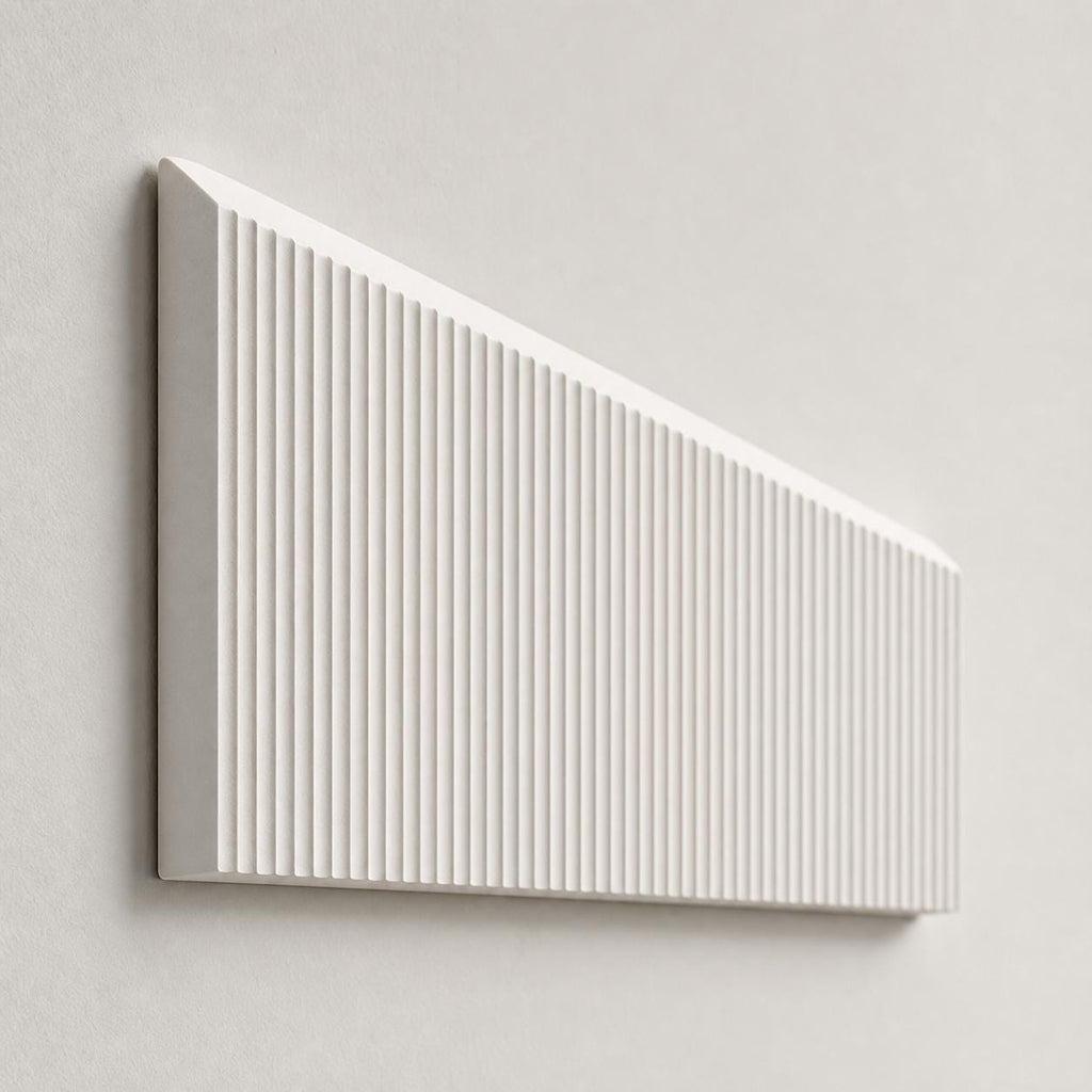 Side-angle close-up of the Ivory White RidgeLoom relief tile showing its ribbed wedge depth