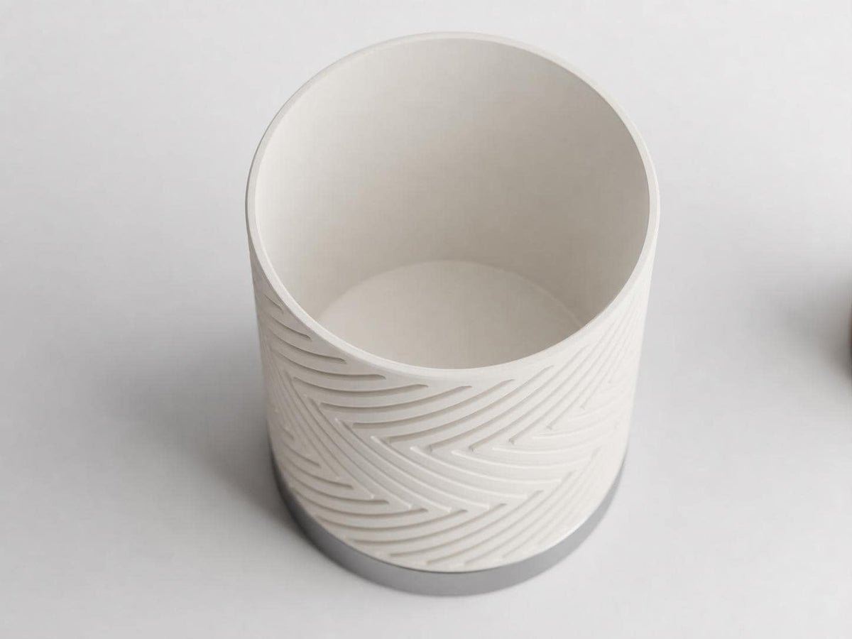 Close-up overhead view of the GleamRidge planter in Moonlit Pearl showing its open top and chevron body