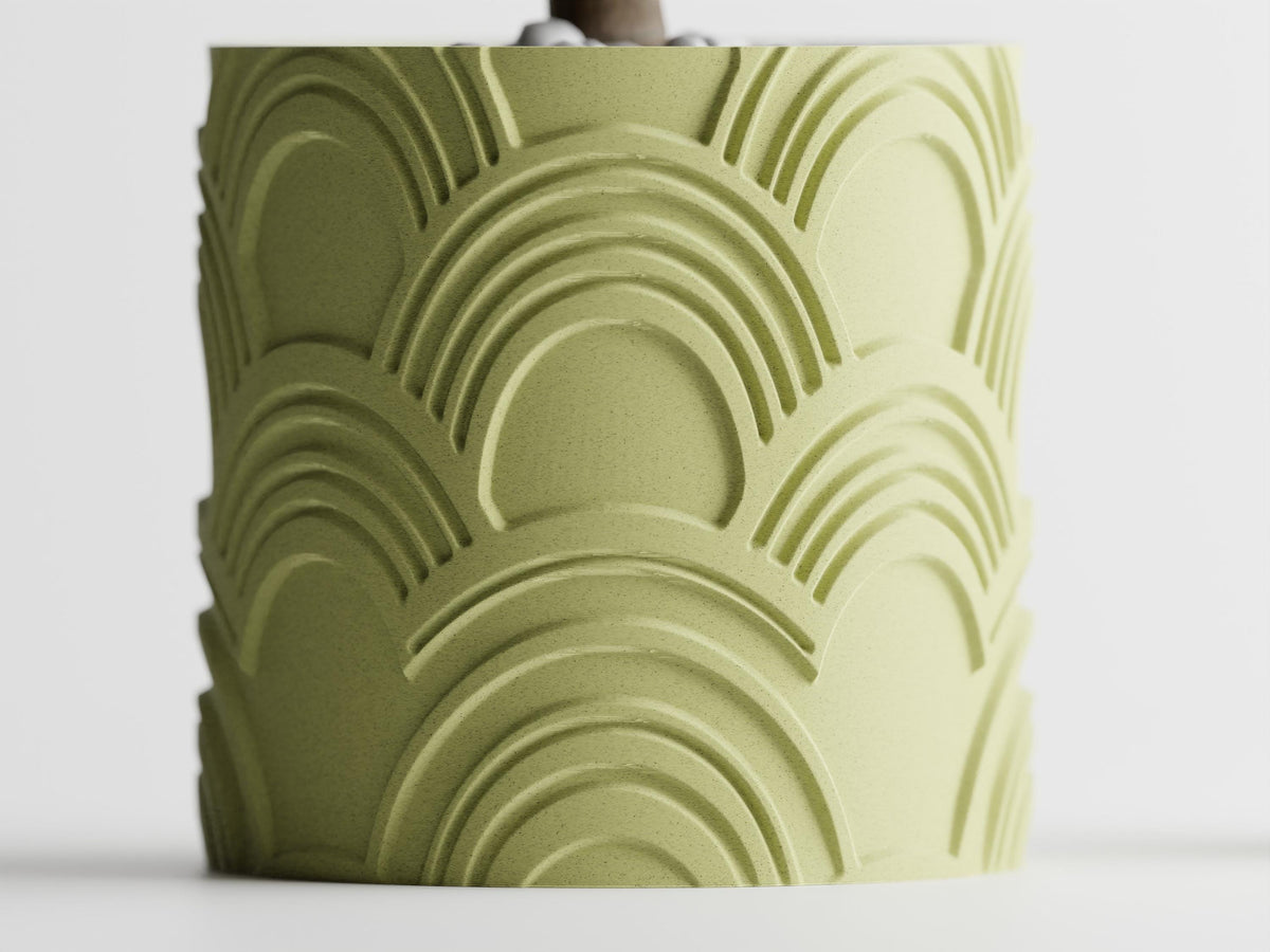 Straight-on close-up of the repeating recessed arch pattern on an ArcEcho planter