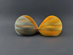 Rear view of two TideNest holders showing the continuous wave pattern