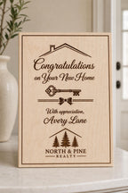 Closing Key engraved birch appreciation sign upright in a refined closing-table setting with North and Pine Realty and Avery Lane.