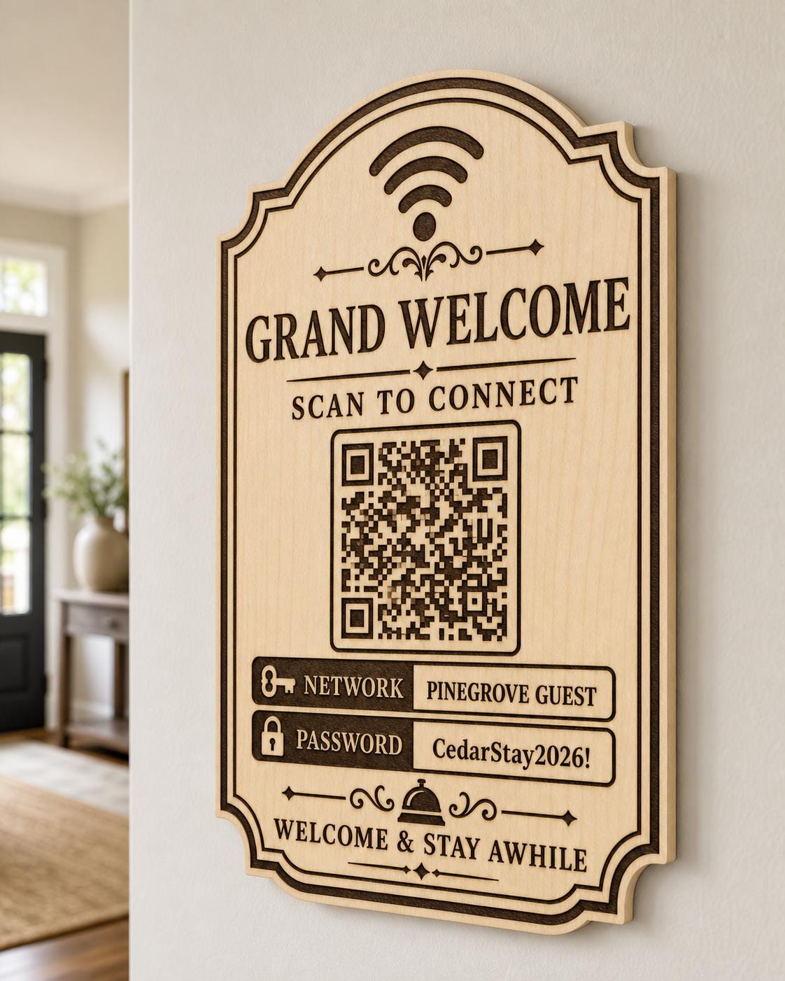 Grand Welcome Guest WiFi Sign engraved birch sign mounted on a realistic neutral interior wall from a close side angle in natural birch and dark engraving, showing the QR code and guest network details.