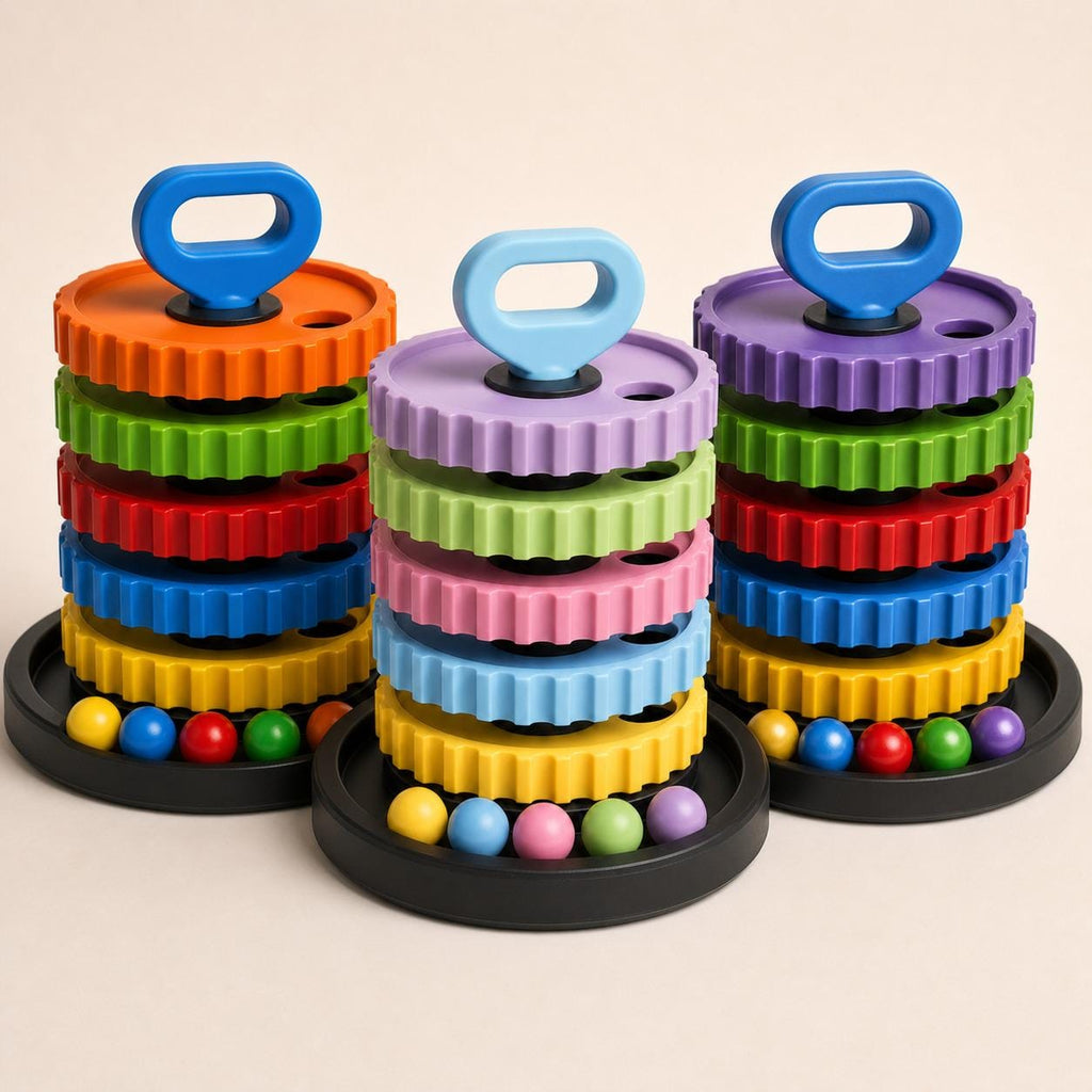 Three CogCascade learning towers in bright, pastel matte, and lustrous colorways, each with a black base, shown together on a warm white background.