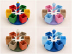 Four SpinBloom classroom supply carousel colorways shown in a close-up four-panel collage on plain light backgrounds.