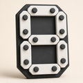 Chalk Contrast DigitPath number board with ivory bars and charcoal round guides forming the numeral 8, close front three-quarter view.