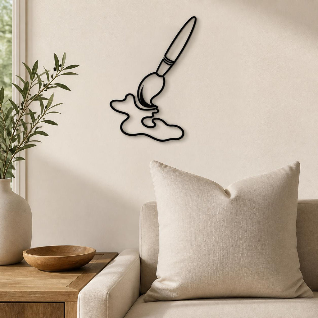 Artist Paintbrush wall art in black, shown at 12-inch scale in a modern living room