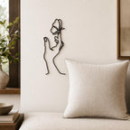 Butterfly Hand wall art in black, shown at 12-inch scale in a modern living room