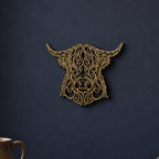 Close-up of Highland Cow filigree wall art in Cocoa Brown in a contrasting room