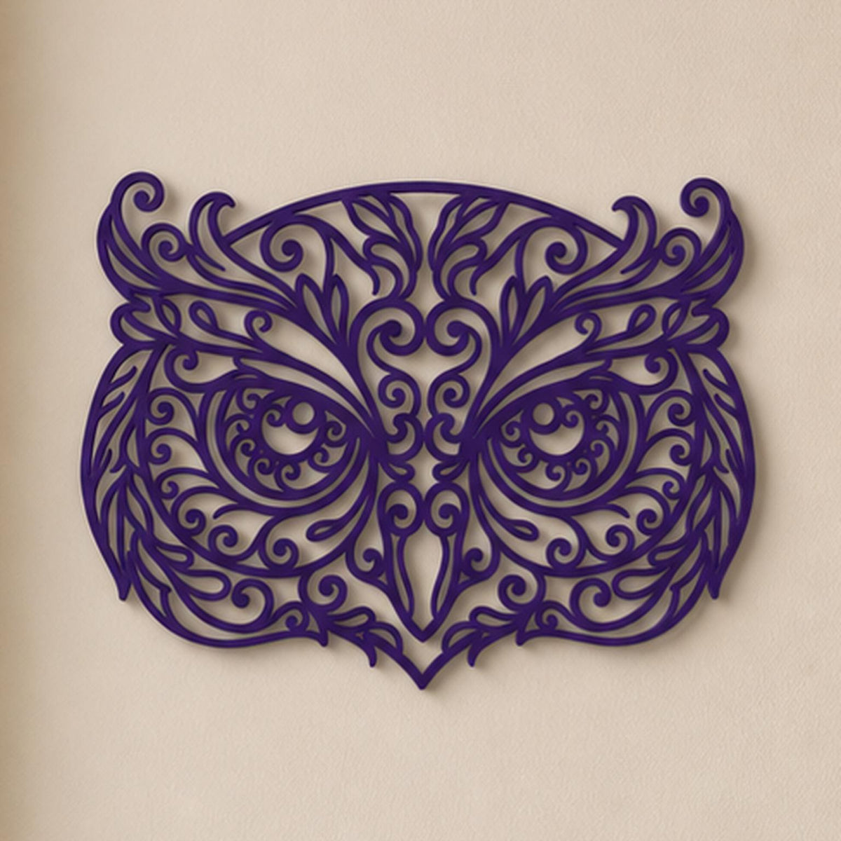Close-up of Owl filigree wall art in Bronze in a contrasting room