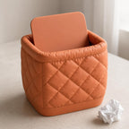 Close-up of the WovenCloud Diamond Quilt desktop bin in Terracotta with swivel lid open