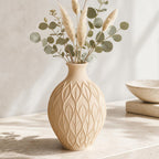 Close-up of the CanopyMuse leaf relief vase in Beige with dried eucalyptus and pampas stems