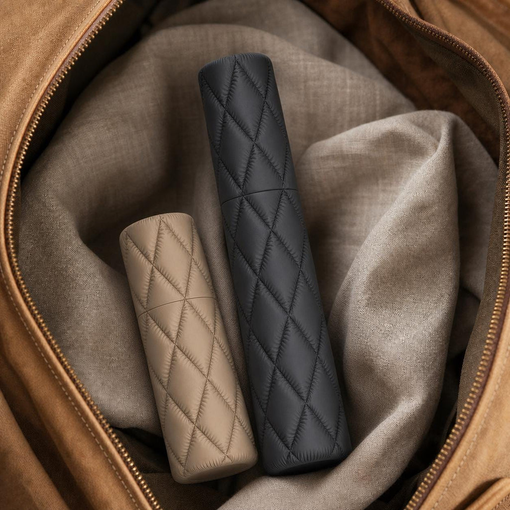 Close-up of complete Charcoal and Desert Tan Cloudquilt cases packed in a travel bag