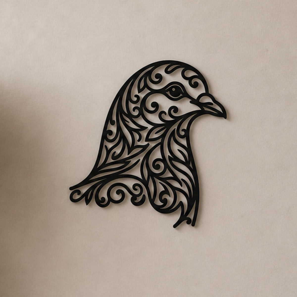 Close-up of Falcon Head filigree wall art in black at accurate 12-inch scale