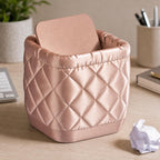 Close-up of the QuiltCore Diamond Quilt desktop bin in Silk Rose Gold in a real home office