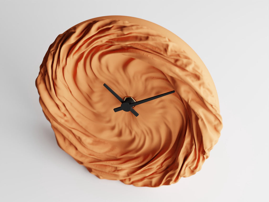 Angled close-up of the FoldWhirl wall clock and sweeping fabric-look folds