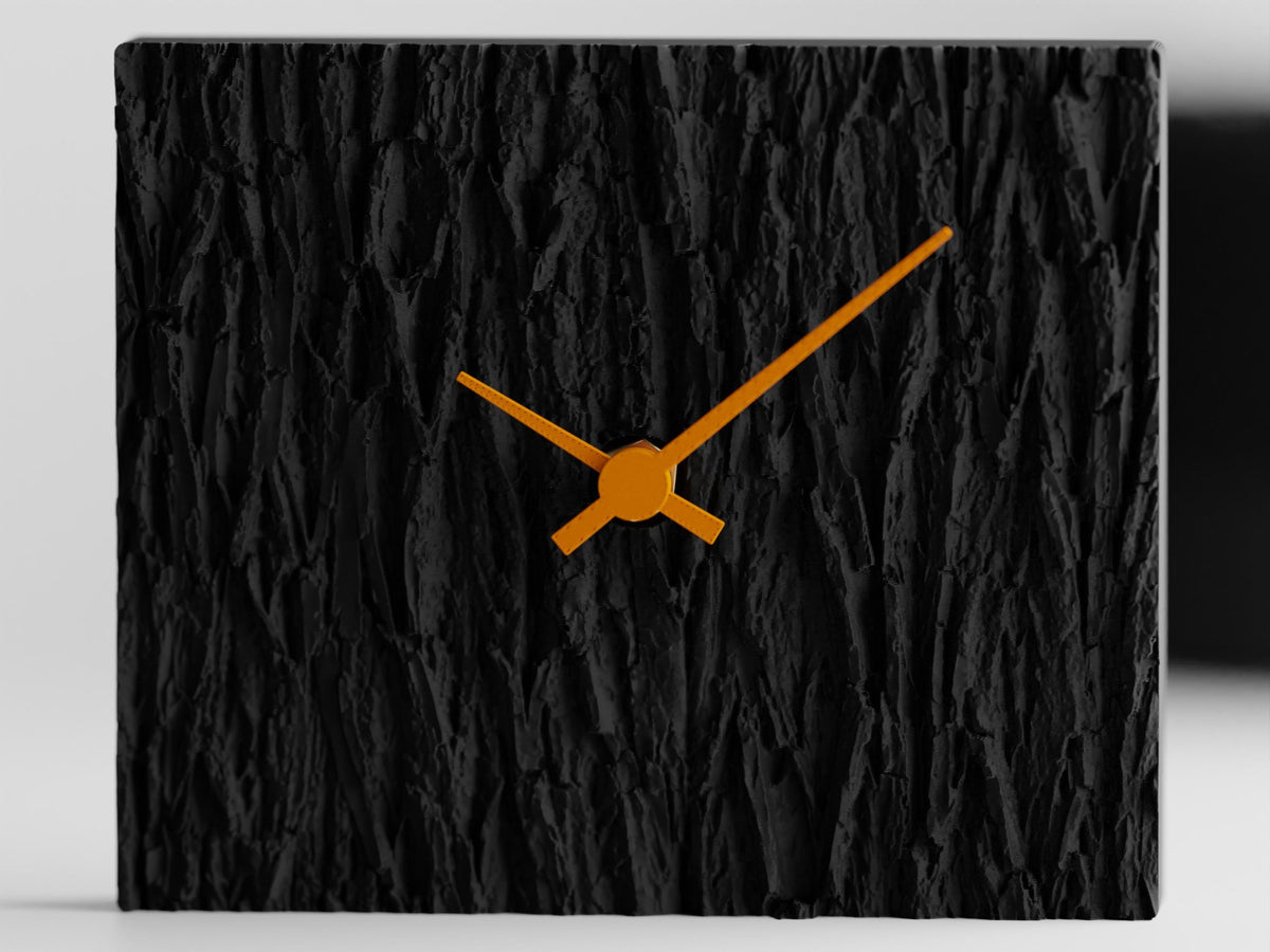 Barkhaven sculptural table clock in Charcoal with Mandarin Orange hands
