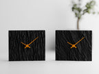 Riven Bark and Vertical Bark clock styles shown side by side in Ember Bark colors