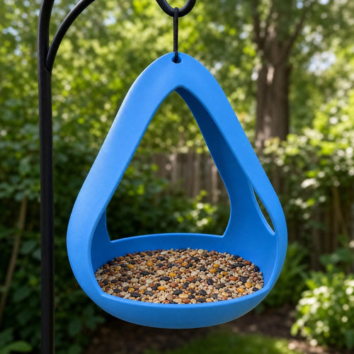 Lake Blue AeroNest open frame hanging bird feeder filled with mixed seed in a garden
