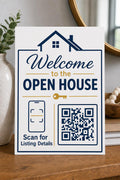 HouseKey multicolor listing-details sign upright on a light entry console with a finished sample QR code.