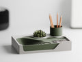 TerraceHub organizer in Woodland Ivory, with Ivory White frame and Dark Green landscape and pen cup on a desk.