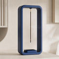 Close-up of a Cobalt Blue AeroCinder suspended incense stand on a warm neutral shelf