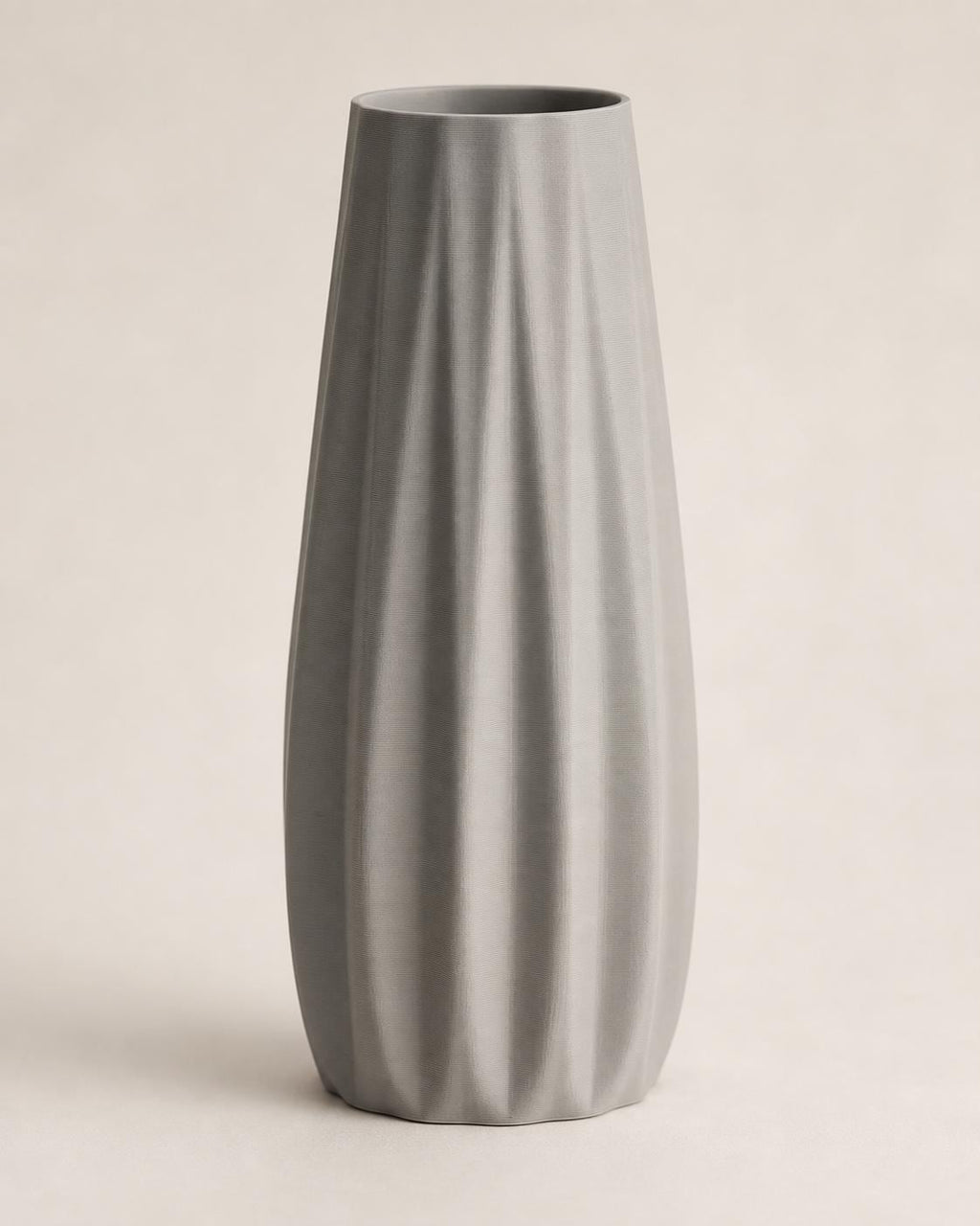 Front close-up of an empty Nardo Gray Loomrise vase on a warm neutral background