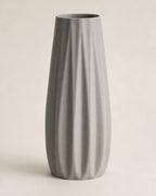 Front close-up of an empty Nardo Gray Loomrise vase on a warm neutral background