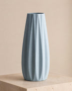 Rear three-quarter close-up of an empty Ice Blue Loomrise ribbed vase