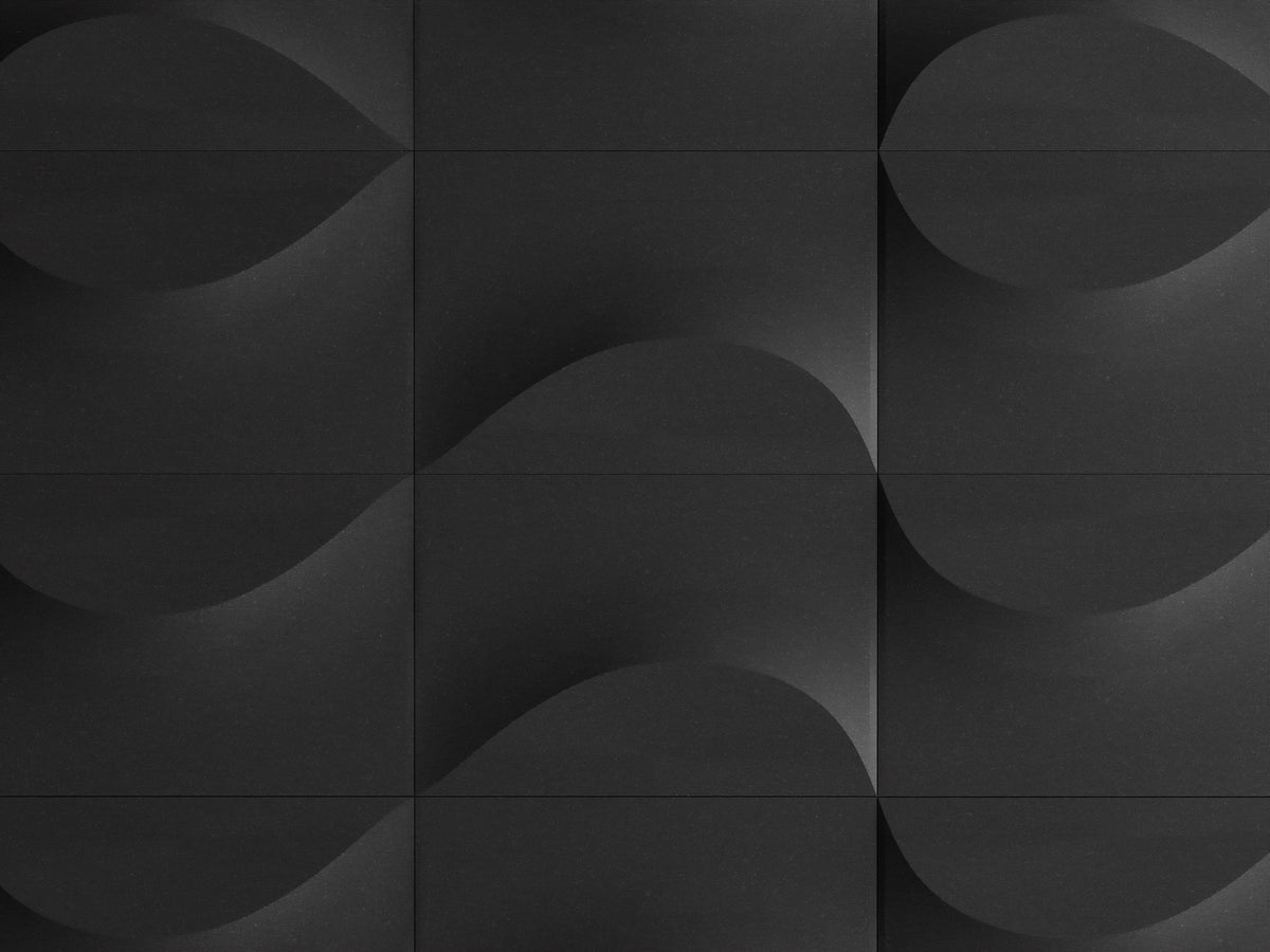 Front close-up of a charcoal TideFold tile arrangement with alternating relief directions